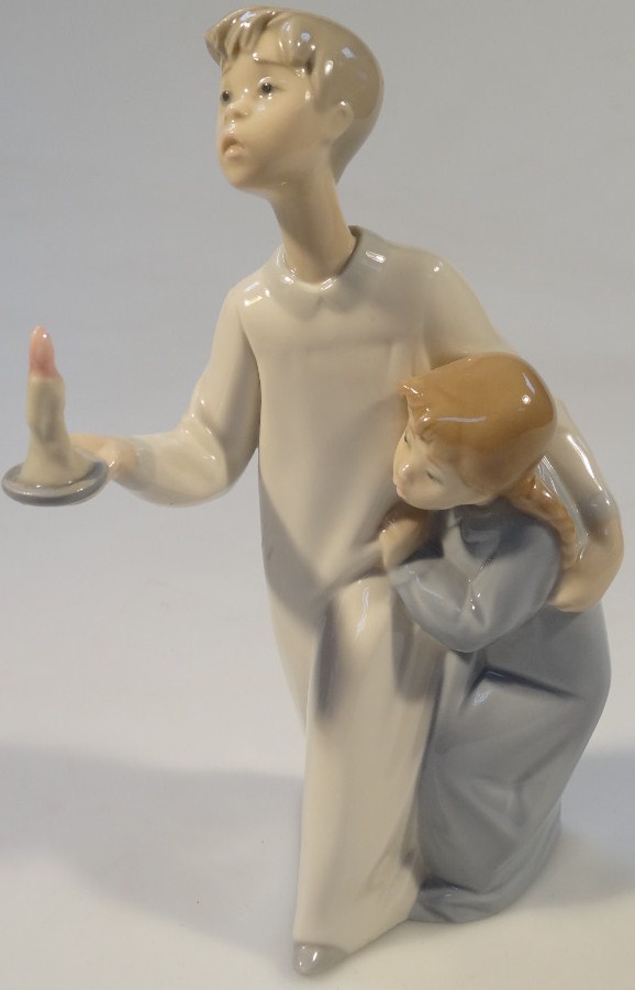 Appraisal: A thC Lladro figure group of two children each in