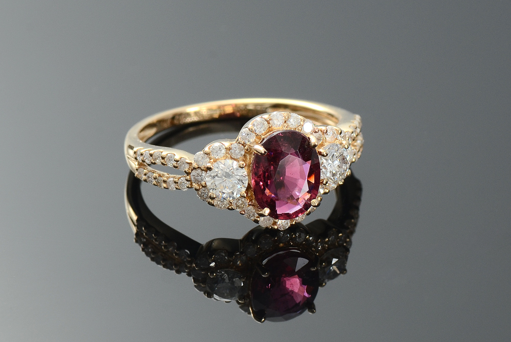 Appraisal: ORIANNE RUBELLITE TOURMALINE RING WITH DIAMONDS K yellow gold ring