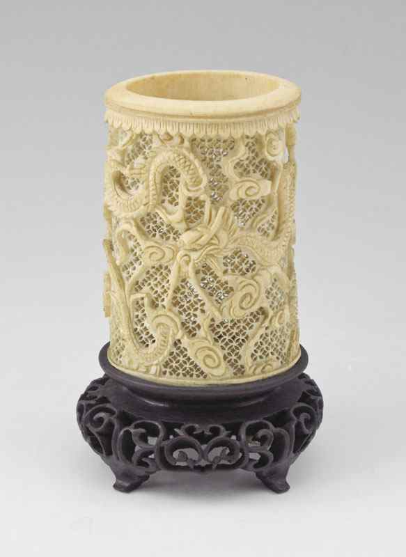 Appraisal: CHINESE CARVED AND PIERCED IVORY BRUSH HOLDER Delicate pierce work