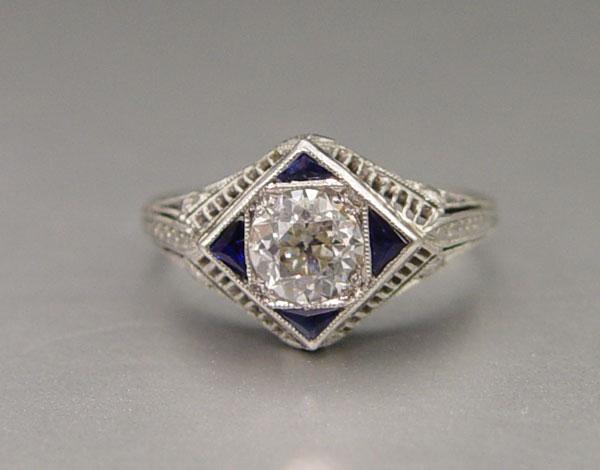 Appraisal: PLATINUM ART DECO DIAMOND AND SAPPHIRE FILIGREE RING The center