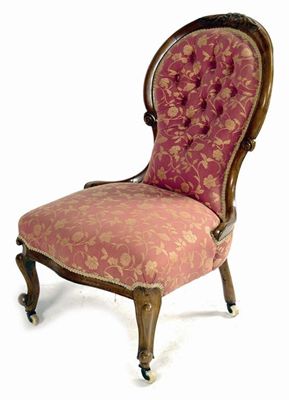 Appraisal: A Victorian carved walnut show frame nursing chair with a