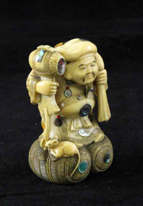 Appraisal: A Japanese ivory and shibayama style figure of Daikoku early