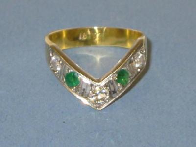 Appraisal: A DIAMOND AND EMERALD FIVE STONE RING of V form