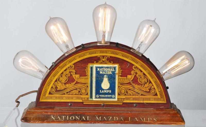 Appraisal: Tin Litho Mazda Lamp Display with Wooden Base Description Working