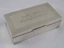 Appraisal: A silver cigarette box with engine turning and dedication from