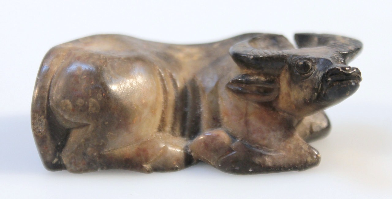 Appraisal: A Chinese soapstone figure of a recumbent water buffalo in