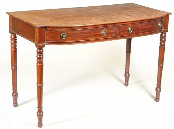 Appraisal: A Regency mahogany bow front two-drawer side or serving table