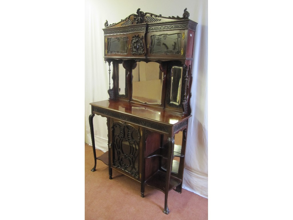 Appraisal: An Edwardian mahogany drawing room cabinet the carved pediment raised