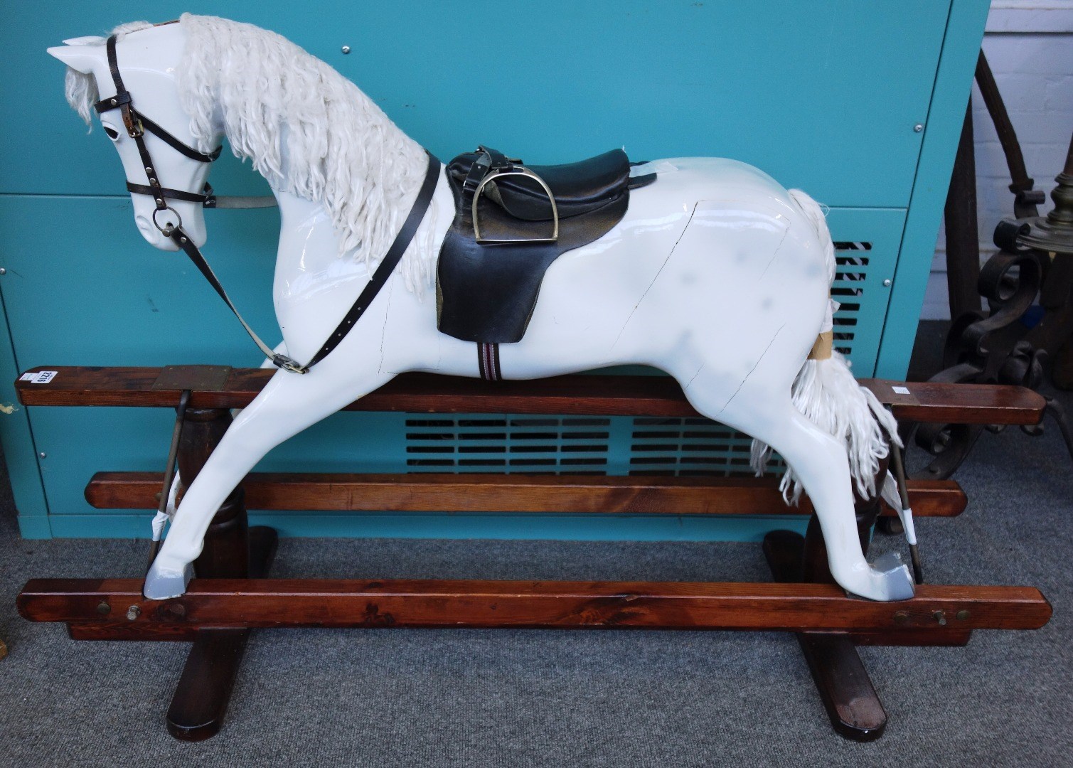 Appraisal: A painted wooden rocking horse mid th century dapple grey