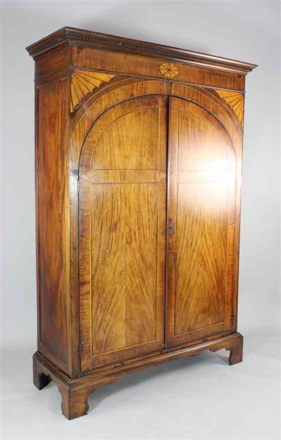 Appraisal: A George III satinwood inlaid mahogany wardrobe with two arched