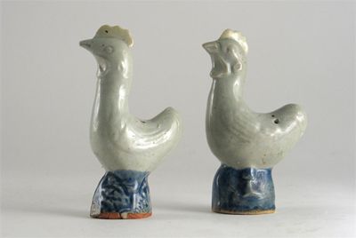 Appraisal: A pair of Chinese models of cockerels their heads raised