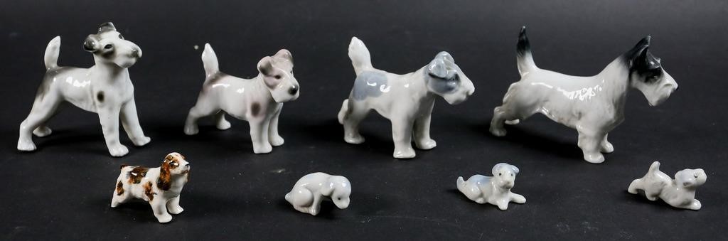 Appraisal: German porcelain terrier dog figurines marked on the paw Germany