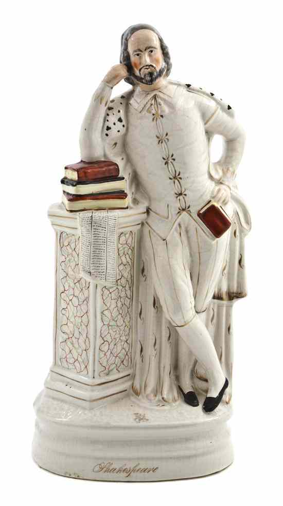 Appraisal: A Staffordshire Figure depicting a standing Shakespeare near a pedestal