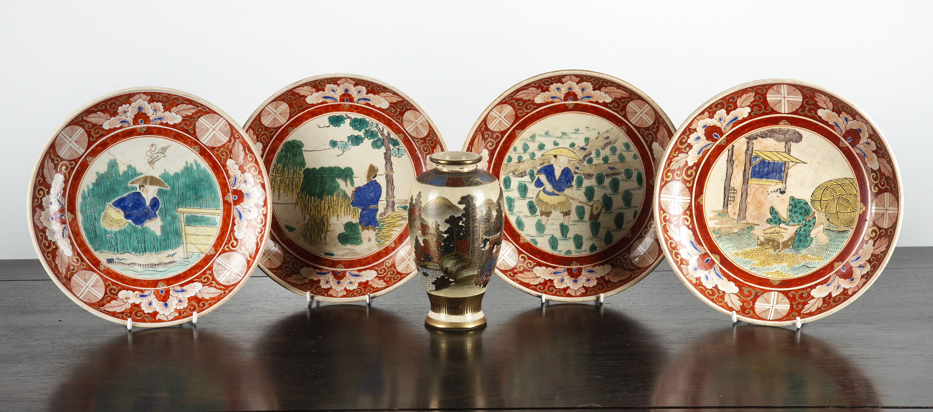 Appraisal: Set of four Kutani dishesJapanese each depicting figures working on