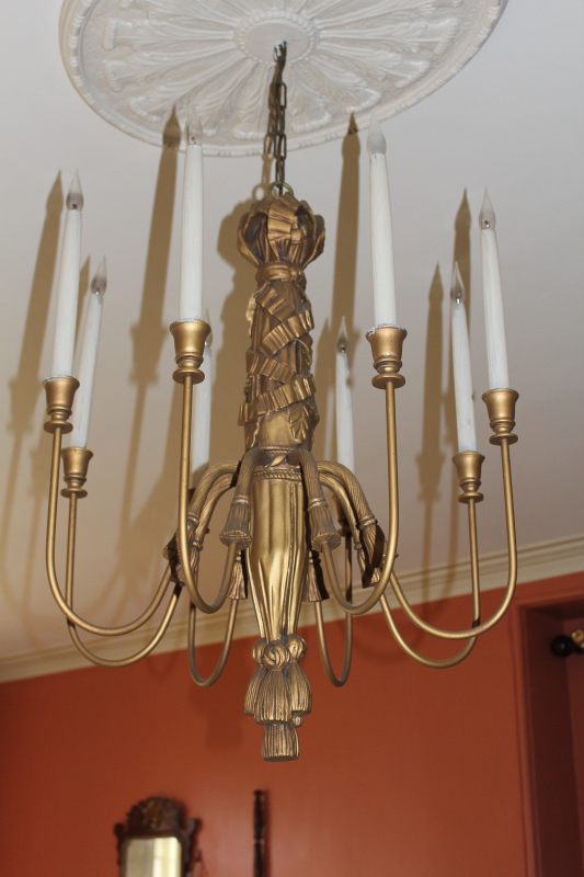 Appraisal: A gilt pendant light fitting with with ribbon and tasselled