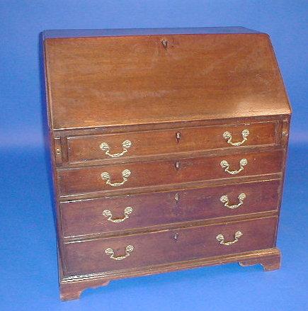 Appraisal: A George III oak bureau the fall flap revealing fitted