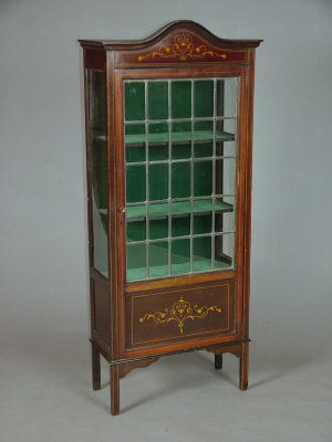 Appraisal: An Edwardian stained beechwood lead glazed china display cabinet with