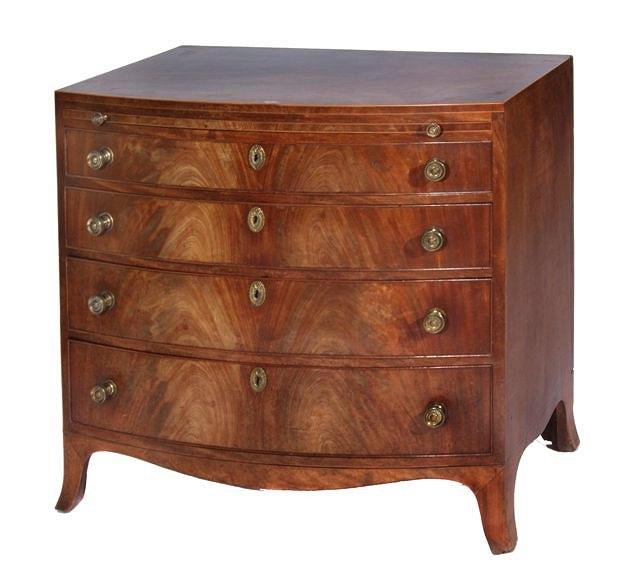 Appraisal: A GEORGE III MAHOGANY BOW FRONTED CHEST of four long