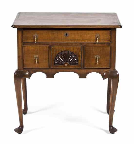 Appraisal: An American Tiger Maple Diminutive Desk the rectangular top over