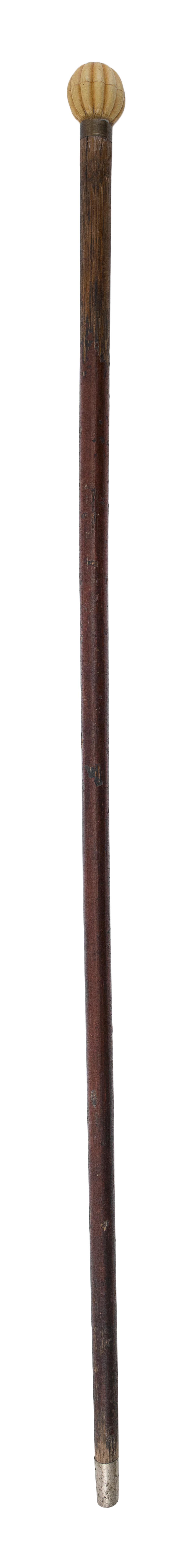 Appraisal: CANE WITH WHALEBONE HANDLE Globular handle with deeply carved lobes