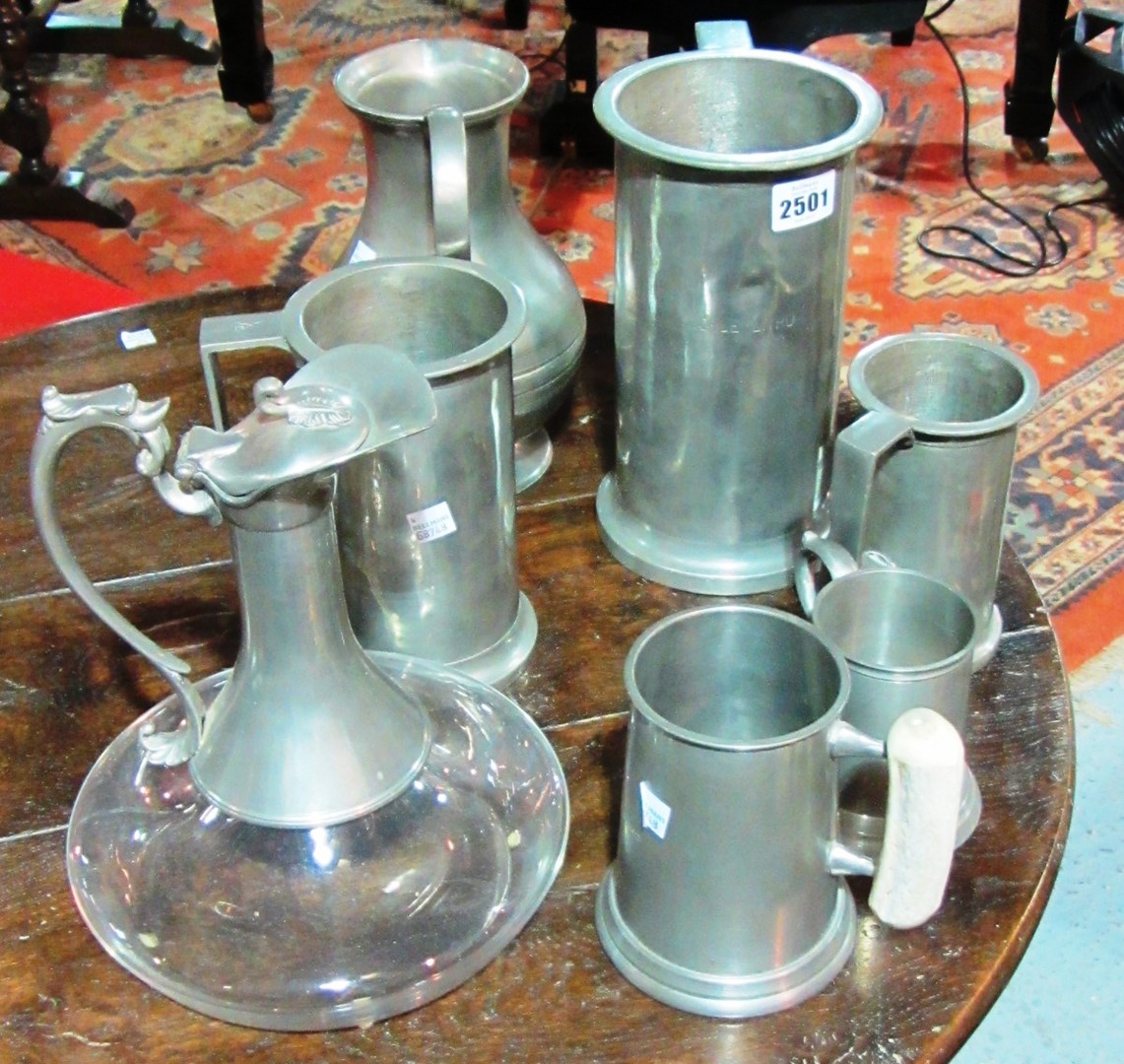 Appraisal: A quantity of various pewter jugs tankards and a silver