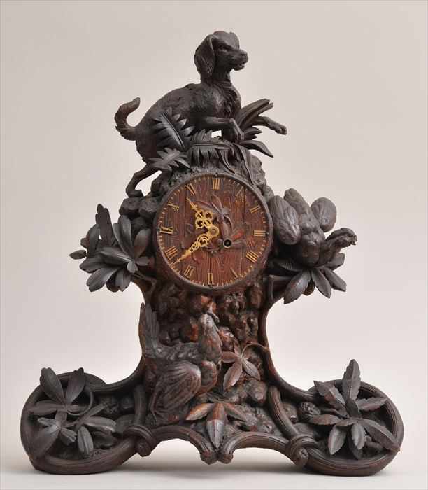 Appraisal: BLACK FOREST CARVED WALNUT MANTEL CLOCK The faux-bois dial with