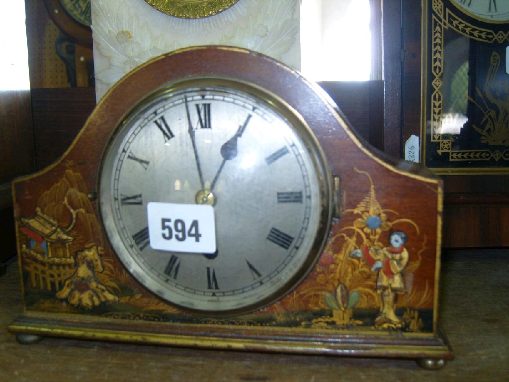 Appraisal: A small mantle clock with arched outline with chinoiserie case