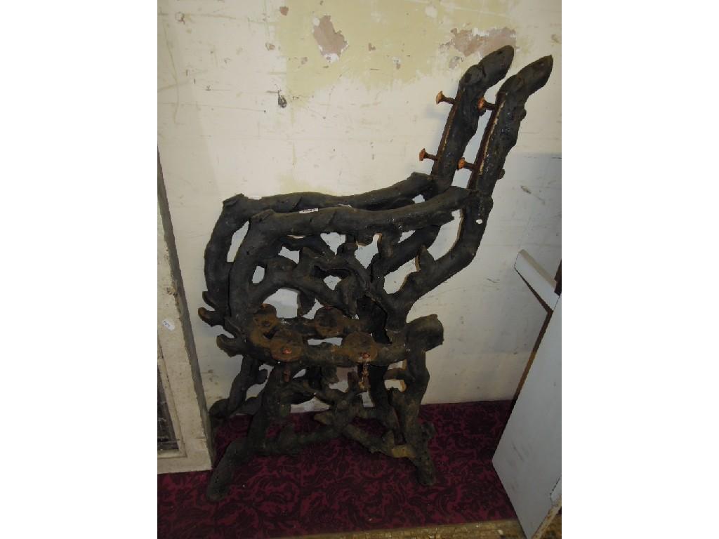 Appraisal: A pair of heavy cast iron bench ends with naturalistic