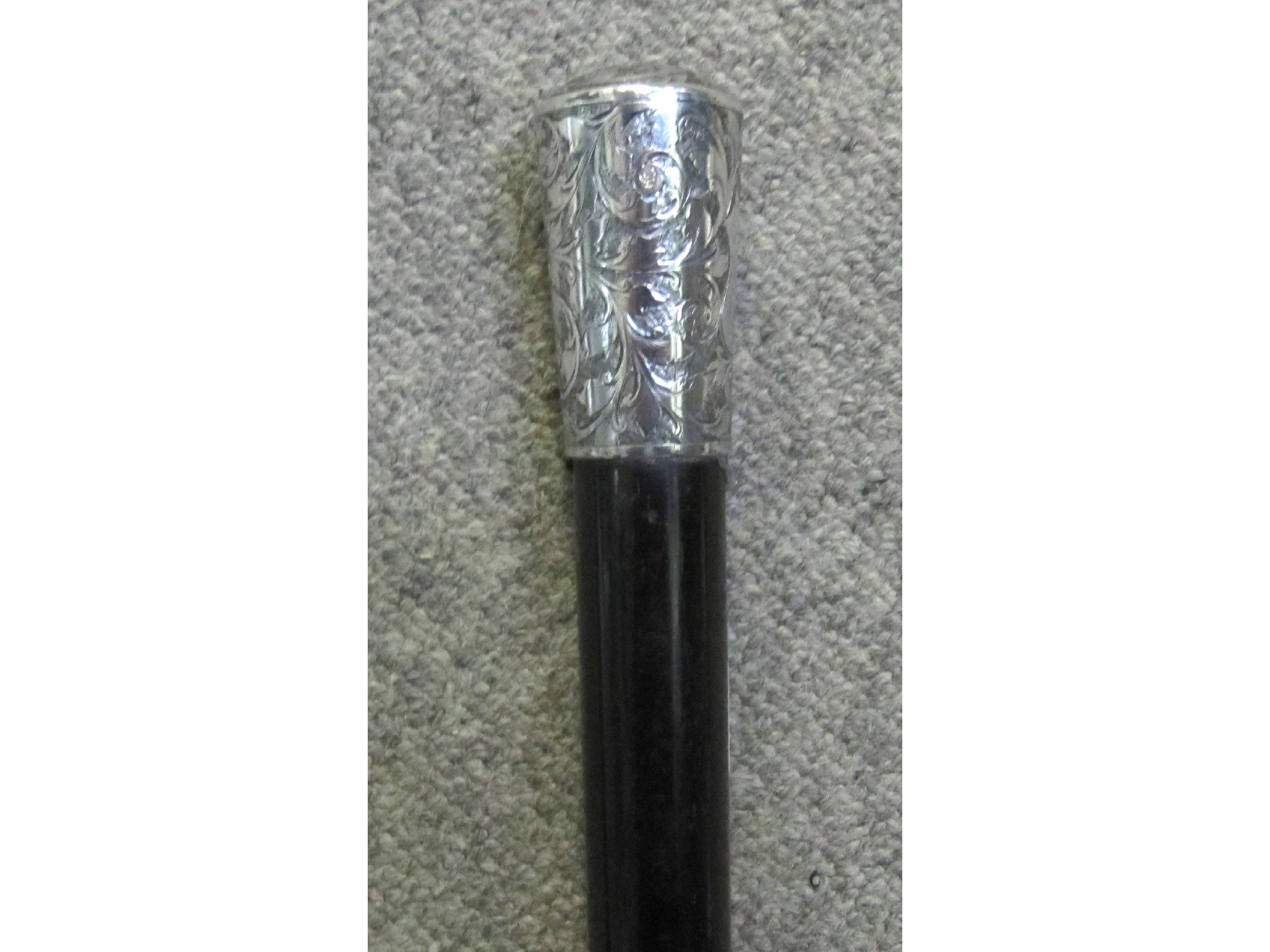 Appraisal: A walking cane with white metal handle