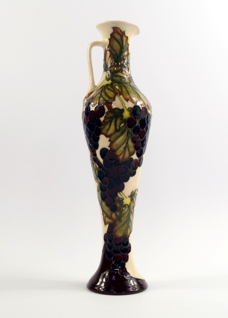 Appraisal: A Moorcroft pottery ewer decorated in the Grapevine pattern of