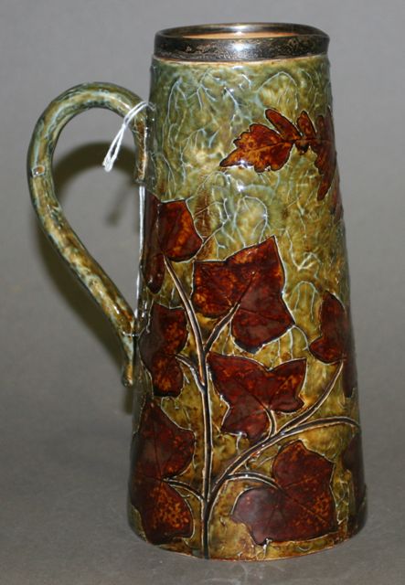 Appraisal: A Doulton Lambeth salt glaze ewer decorated with natural foliage