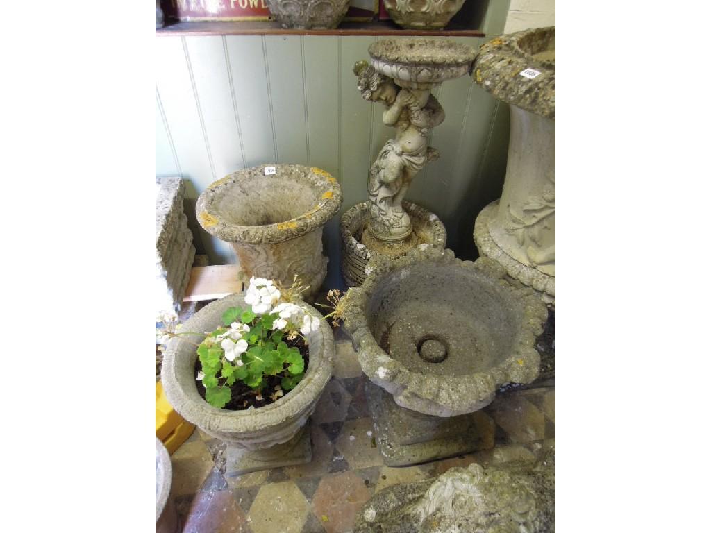 Appraisal: Five weathered cast composition stone garden urns planters of varying