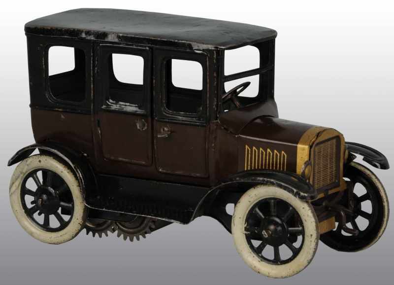 Appraisal: Tin Orobr Car Wind-Up Toy Description German Working Scarcer brown