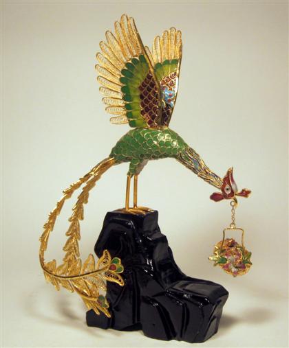 Appraisal: Chinese gilt metal and enamel modelModeled as a stalk supporting