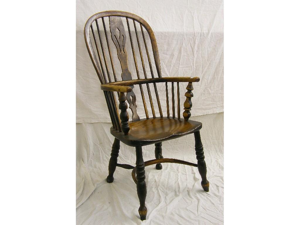 Appraisal: th century Windsor armchair the spindle turned back with pierced