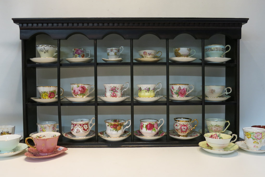 Appraisal: ASSORTED PORCELAIN CUP SAUCERS AND WALL SHELF thirty-two sets various