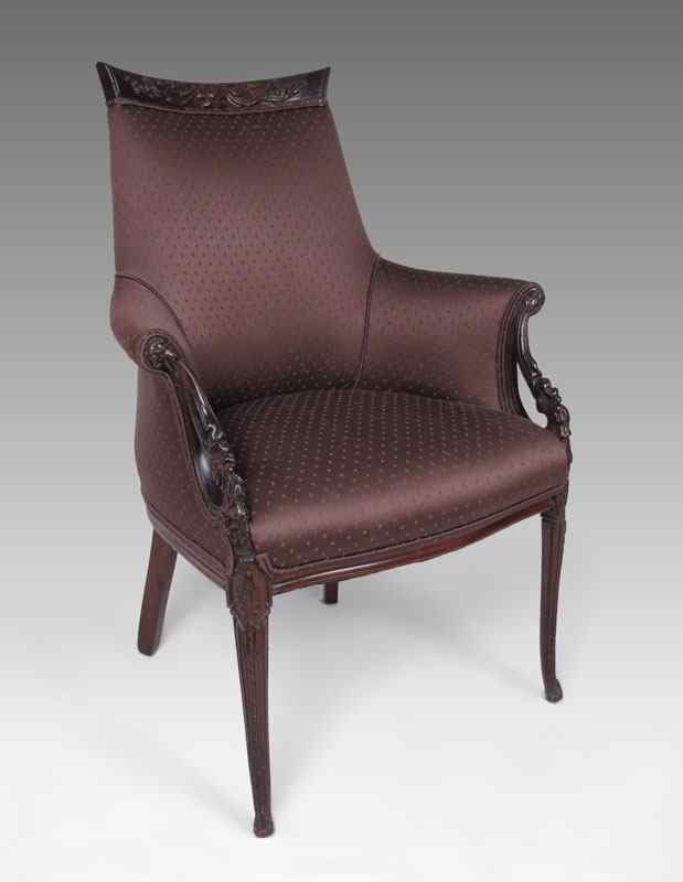 Appraisal: CARVED MAHOGANY FRAMED PARLOR CHAIR Chocolate brown upholstery carved crest