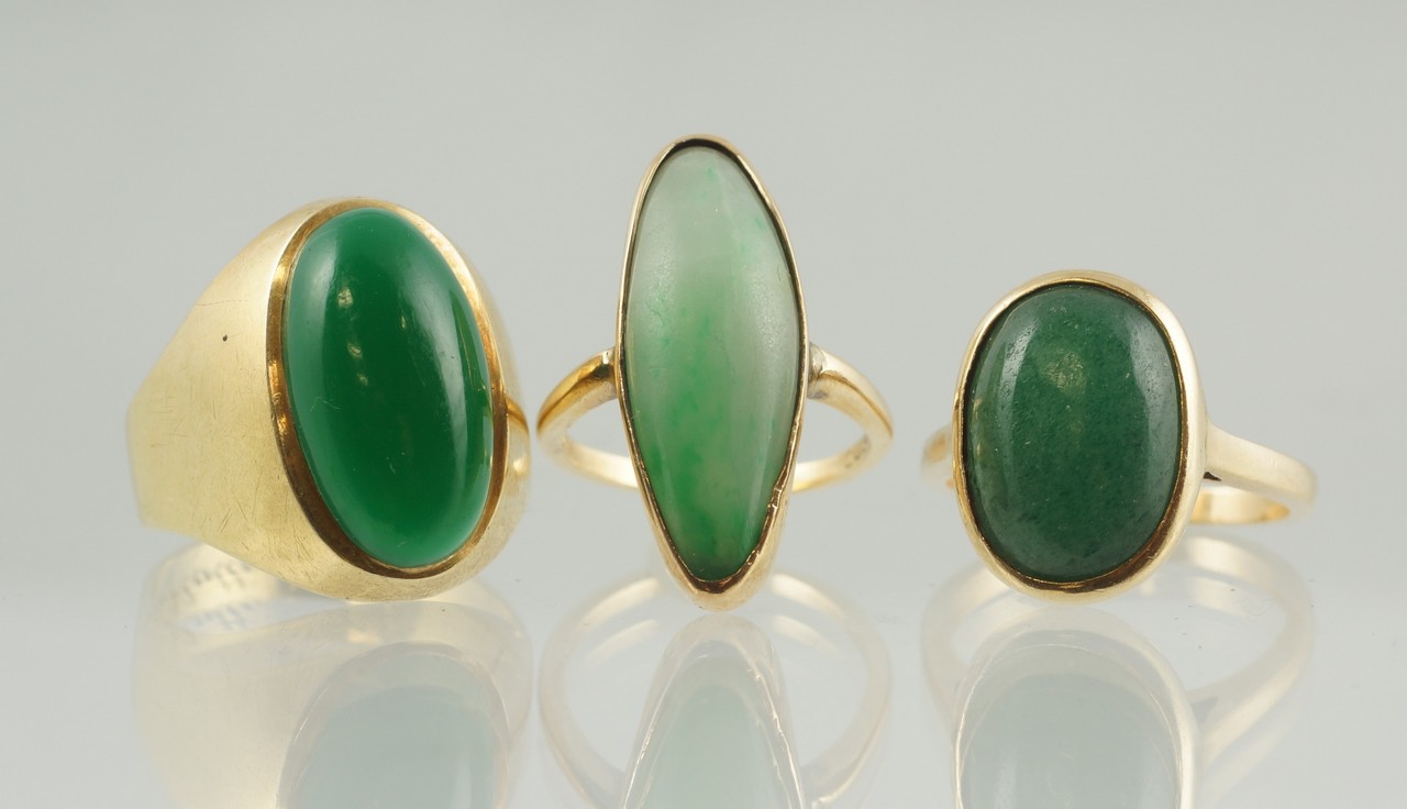 Appraisal: K YG rings with oval green jade stones all stamped