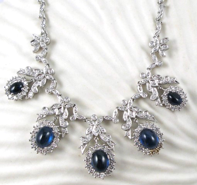 Appraisal: SAPPHIRE DIAMOND AND PLATINUM NECKLACE set with five oval blue