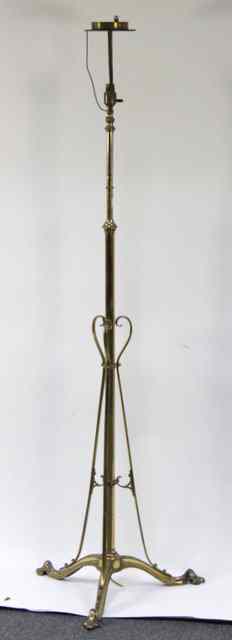 Appraisal: An early th century adjustable brass standard lamp circa converted