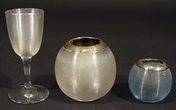 Appraisal: Two globular glass match strikers with silver mounts and a