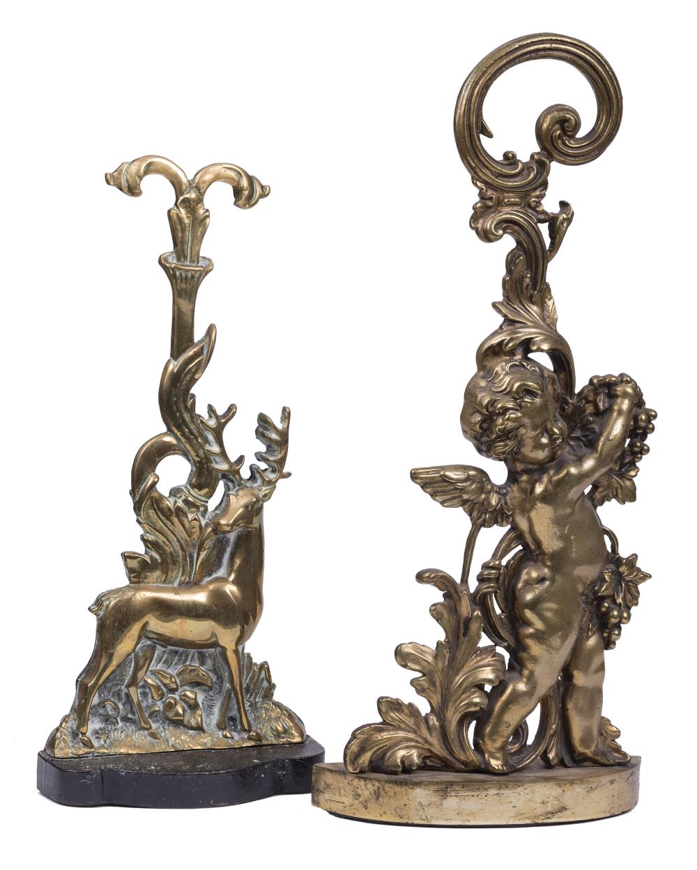 Appraisal: Two English Brass Figural Doorstops one a cherub other a