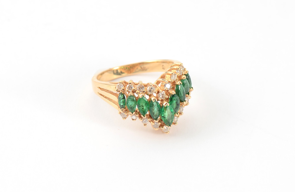 Appraisal: EMERALD DIAMOND RING K yellow gold emerald and diamond ring