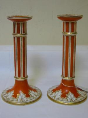 Appraisal: A PAIR OF PORCELLANEOUS CANDLESTICKS of columnar form with spreading