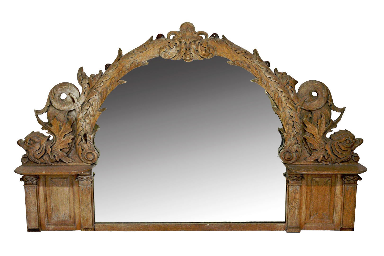 Appraisal: A th century carved limed oak arch top mirror centred