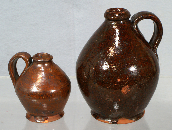 Appraisal: glazed redware ovoid jugs minor chips and glaze flakes tall