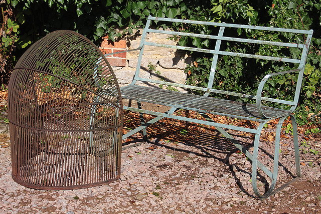 Appraisal: A GREY PAINTED WROUGHT IRON SMALL GARDEN BENCH with curved