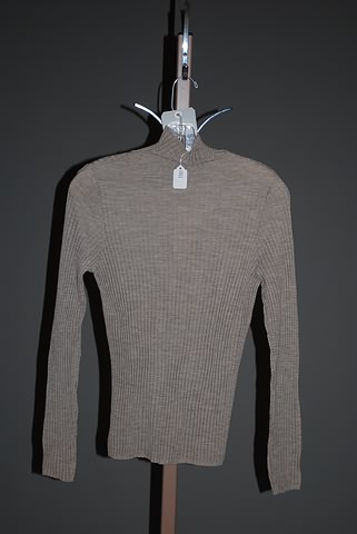 Appraisal: Akris taupe wool long sleeve turtleneck knit with crinkle ribbed