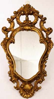 Appraisal: A gilt plaster Florentine style mirror the cartouche shaped plate