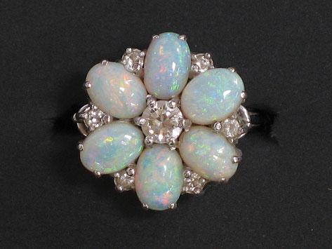 Appraisal: AN OPAL AND DIAMOND CLUSTER DRESS RING the central claw-set